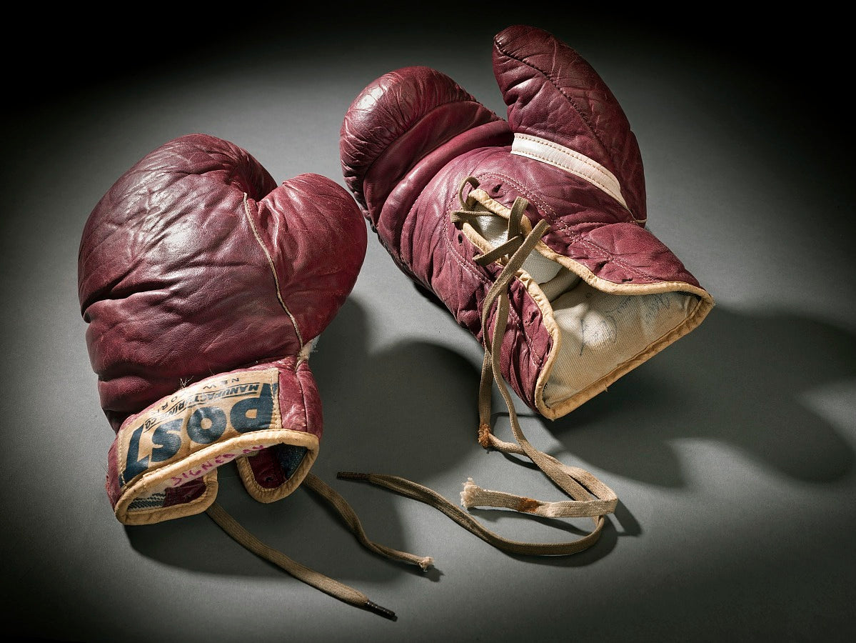 When were gloves introduced to Boxing?
